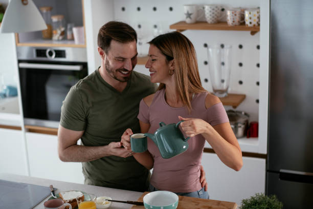 istock Young couple making breakfast at home. 1278564630