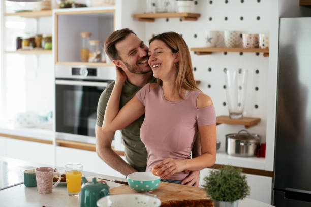 istock Young couple making breakfast at home. 1278564651