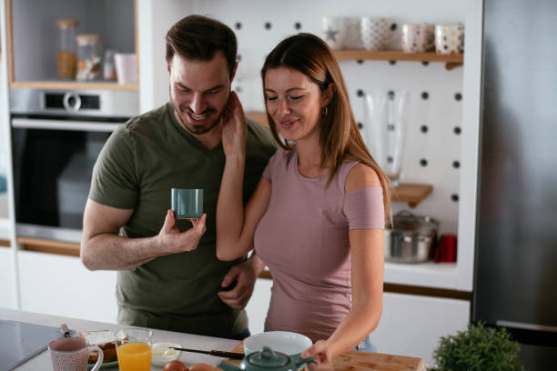 istock Young couple making breakfast at home. 1278564654