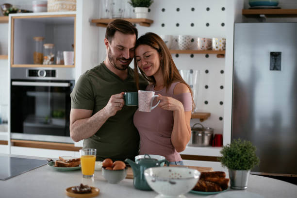 istock Young couple making breakfast at home. 1278564724