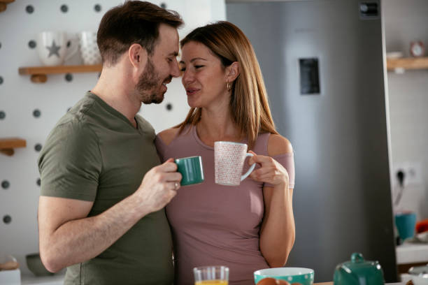 istock Young couple making breakfast at home. 1278564744