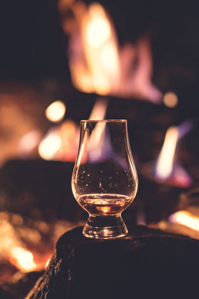 istock Whiskey glass and a campfire 1278568322