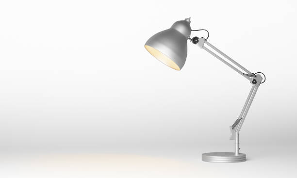 Silver metal desk lamp Silver metal desk lamp isolated on white background, clipping path included. 3d rendering desk lamp stock pictures, royalty-free photos & images