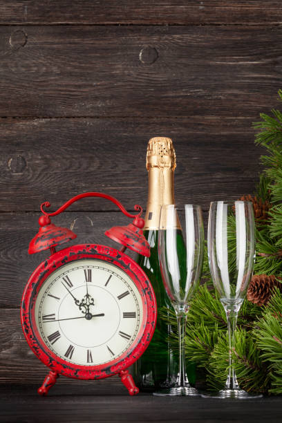 istock Christmas greeting card with fir tree, clock and champagne 1278571173