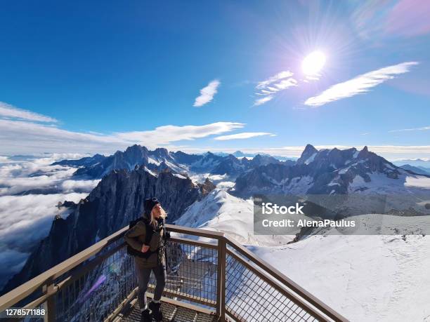 Woman Looking At View From Aiguille Du Midi Chamonix Needles Mont Blanc Hautesavoie Alps France Stock Photo - Download Image Now
