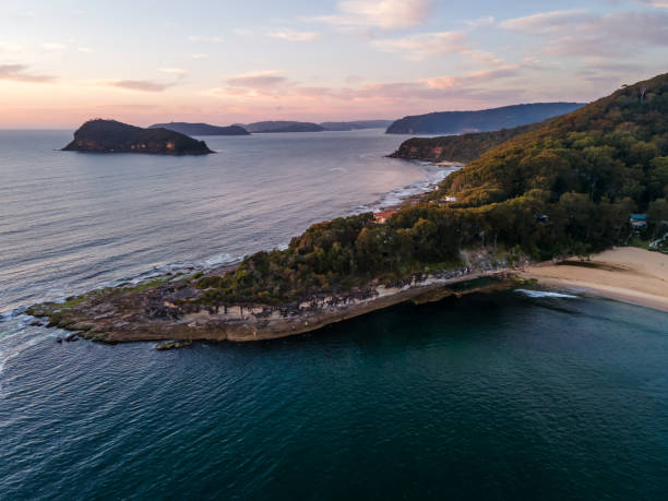istock Calm seas with headland and islands from above 1278576494