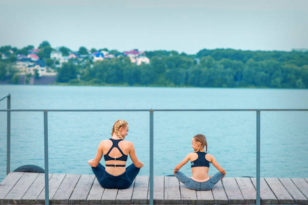 istock Mother and daughter doing gym exercises 1278576660