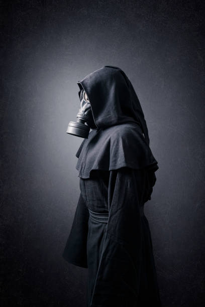 istock Man in a gas mask and hooded cloak. Environment pollution. 1278577409