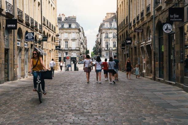 Commercial street in historic centre of Rennes Rennes, France - July 23, 2018: People walking on commercial street in historic centre of the city. rennes france photos stock pictures, royalty-free photos & images