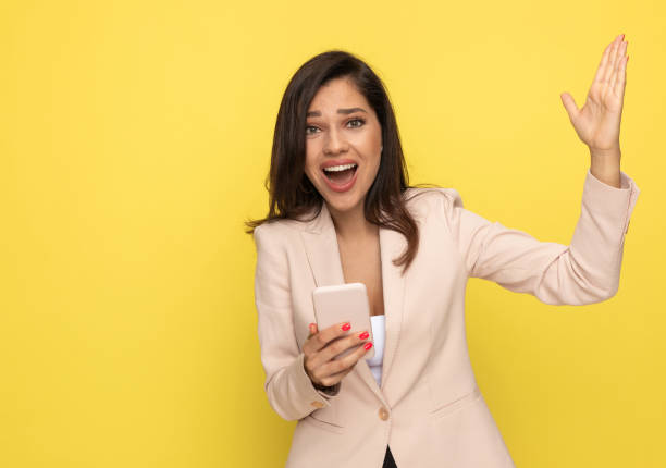 istock enthusiastic young girl holding hand up and presenting 1278579777