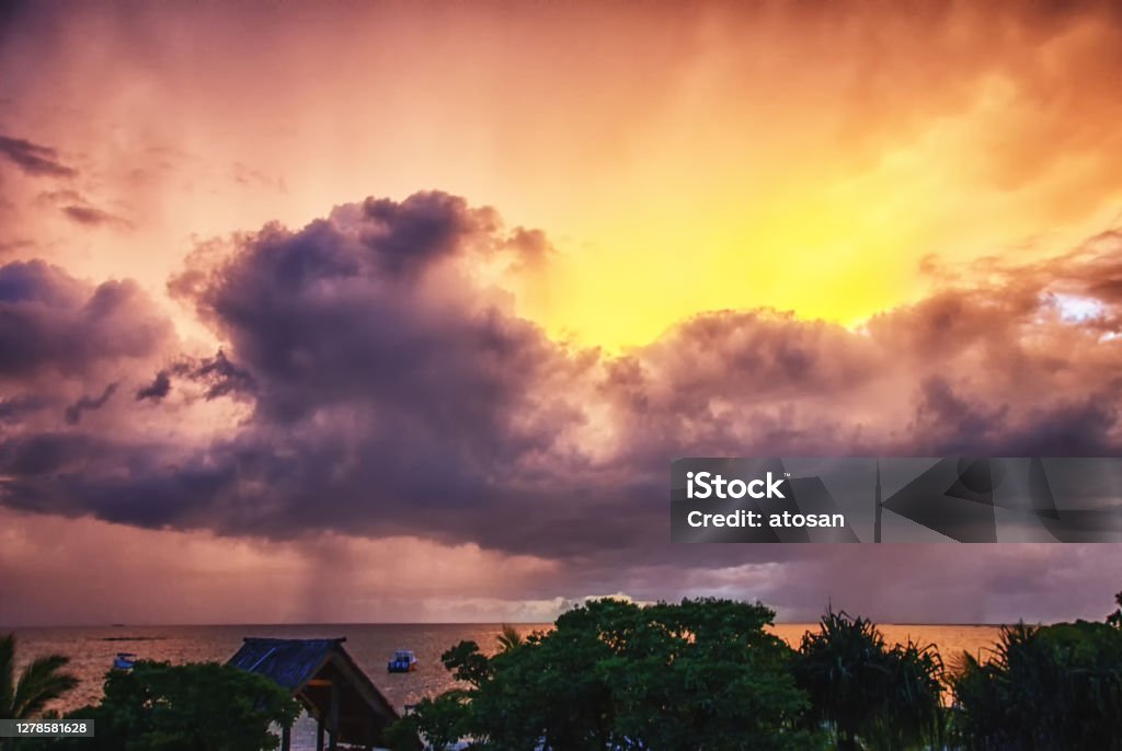 Peaceful sunset at a beach in Fiji Sunset, Viwa Island resort, Yasawa island group, Fiji, South Pacific islands, Pacific Color Image Stock Photo