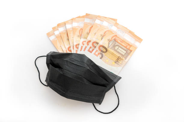 istock Covid-19 masks and money 1278582993