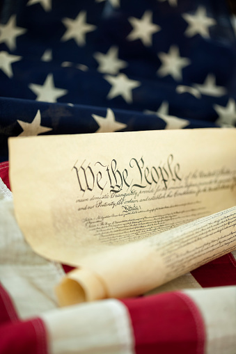 Happy 4th of July - Independence Day USA background banner panorama template greeting card -  American flag and lettering, isolated on wooden table, wood texture