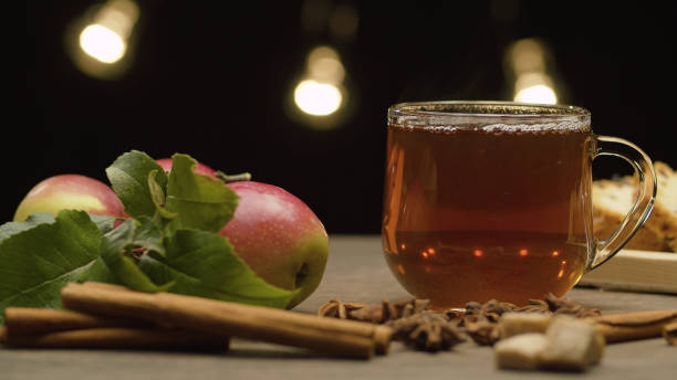 istock Tea in glass mug, apples and spices 1278588417