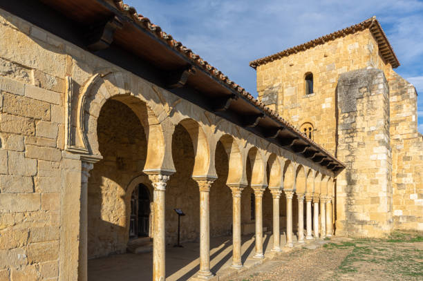 Side view of the Mozarabic monastery of San Miguel de Escalada, in Leon, Spain. The columns of the entry are seen first Side view of the Mozarabic monastery of San Miguel de Escalada, in Leon, Spain. The columns of the entry are seen first mozarabic stock pictures, royalty-free photos & images