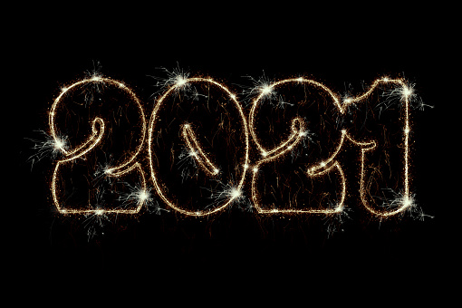 Happy New Year 2021 concept. Sparkling burning numbers Year 2021 isolated on black background. Beautiful overlay template object for design holiday greeting card, billboard and web banner.