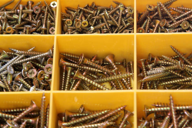 istock golden screws in yellow plastic organizer box 1278589466