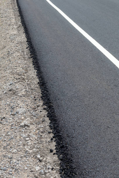 istock Asphalt Road Surface on Concrete Gravel. 1278589499