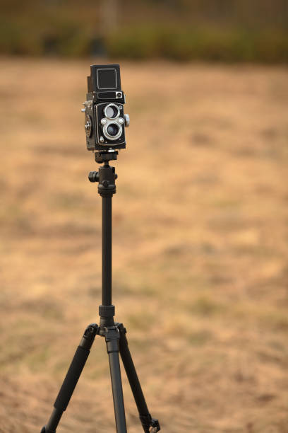 istock The old Japan medium format film TLR camera, released 60's  in an autumn meadow with withered grass. 1278589566
