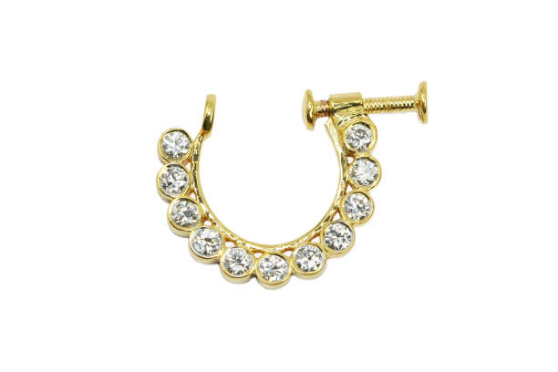 Indian Traditional 11 Diamond Bezel Setting Nose Ring in Yellow Gold stock photo