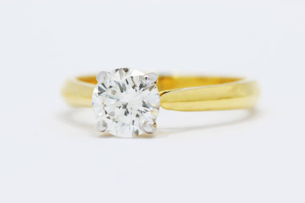 Single Solitaire Diamond Wedding Ring in 4 Prong Setting Yellow Gold - Front View stock photo