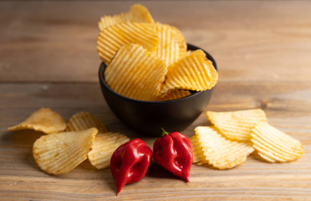istock Homemade chips with hot peppers . Top view. 1278590854