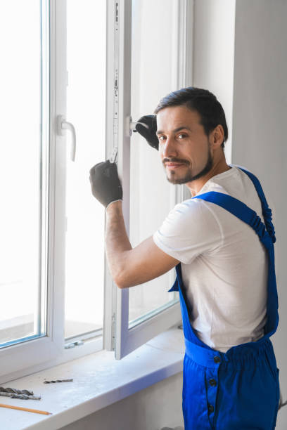 istock Window-maker installs a window in the room 1278591858