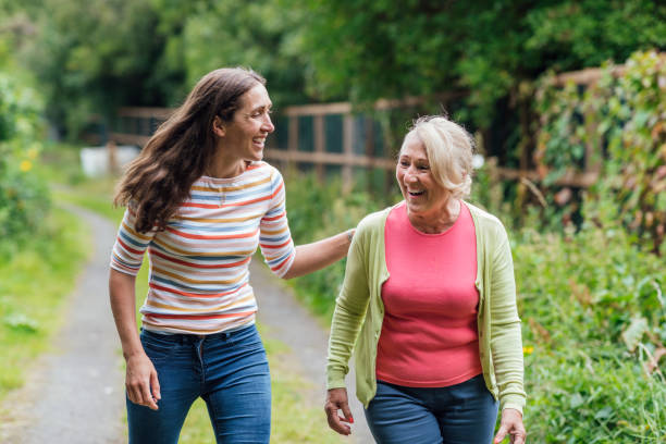 istock Mother and Daughter Walking Together 1278592008