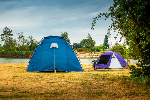 Color photograph of a tent pitched in a campground.
