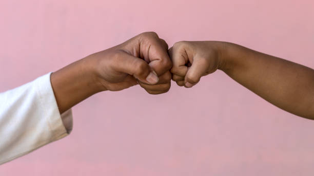 istock Both hands fist against the pink wall. 1278592730