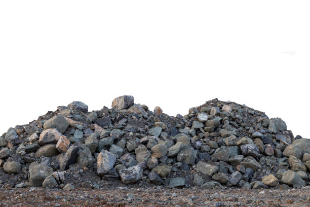 Isolate pile of large granite blocks on the ground in the countryside to prepare materials for construction.