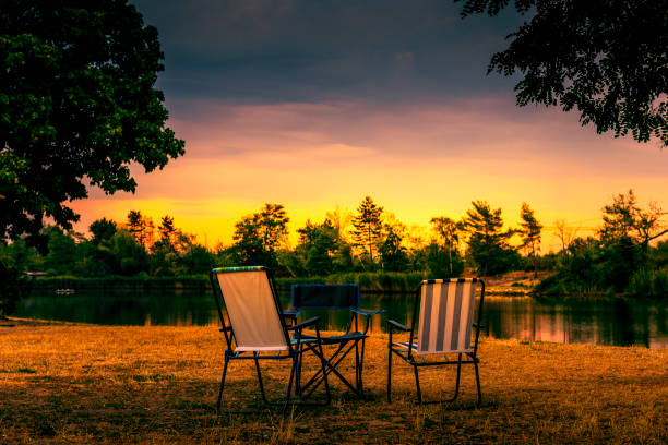 camping chairs and a table on a campsite
