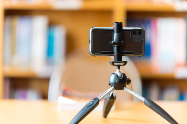 istock A mobile phone mounted on a tripod is used to teach students online at the library. 1278593765