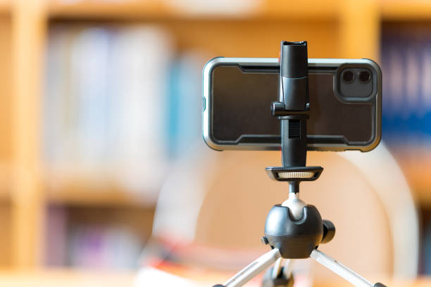 istock A mobile phone mounted on a tripod is used to teach students online at the library. 1278593780