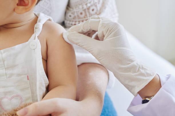 istock Pediatritian wiping spot on arm 1278593936