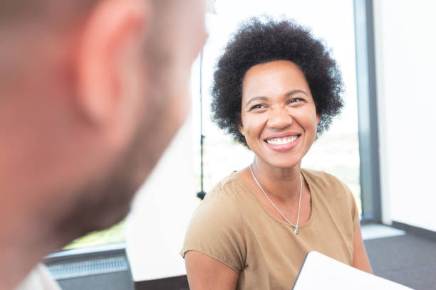 istock Pleased woman smiling at office 1278596946