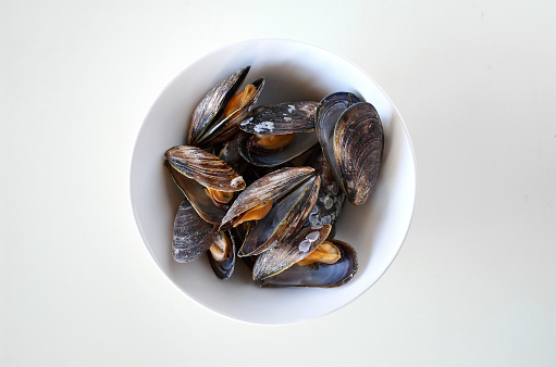 looking down on  fresh mussels in bowl