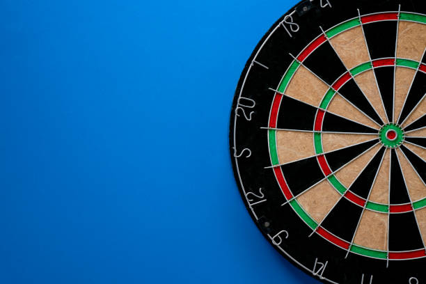 istock target dart board on the blue table background, center point, head to target marketing and business success concept 1278602637
