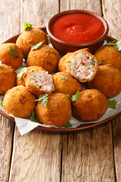 istock Delicious appetizer Sauerkraut balls with ham close-up in a plate. vertical 1278602656