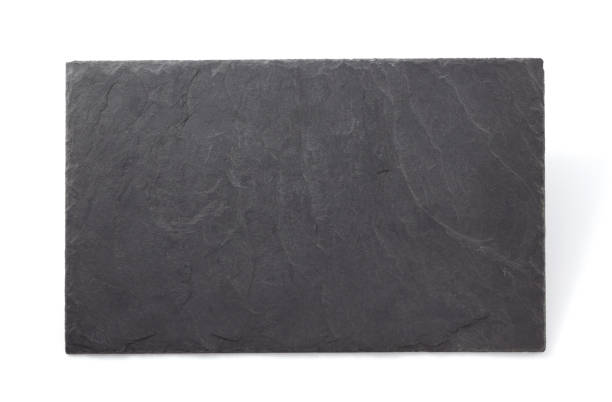 istock black slate stone at wooden background texture 1278604417