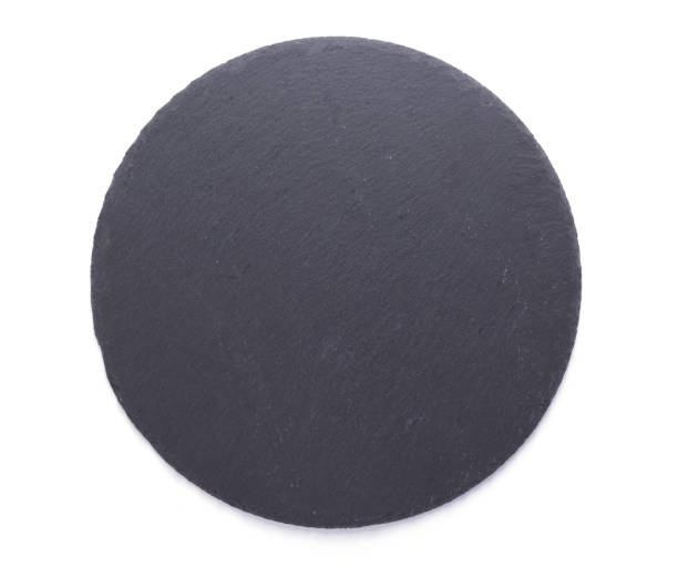 istock black slate stone at wooden background texture 1278605171