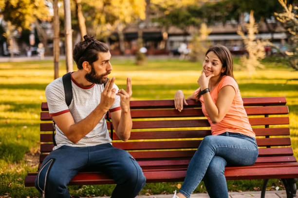 istock Young couple speak in sign language 1278605492