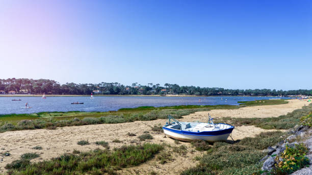 istock Boat stranded on the sand in front of Hossegor lake 1278608448