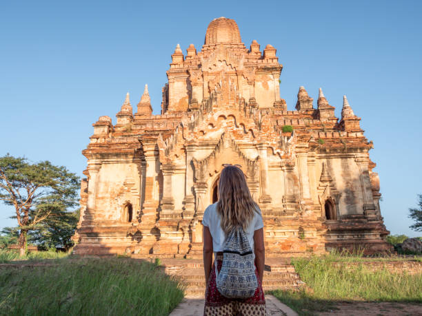 istock Woman contemplates ancient buddhist temple in Bagan 1278608658