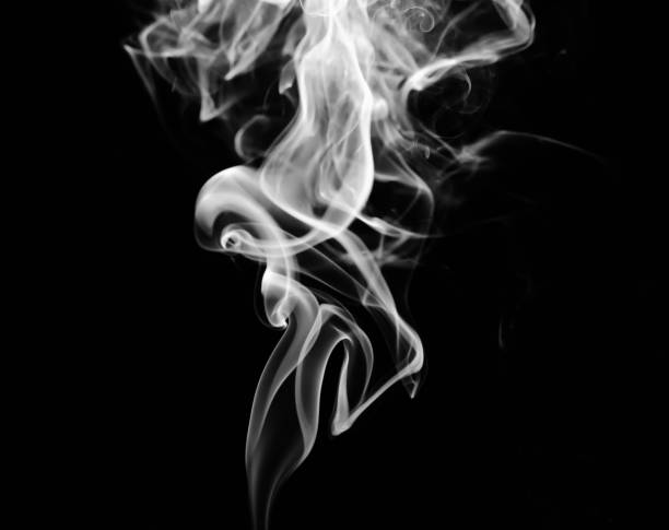 istock abstract fragment movement of white smoke on black background. 1278611748