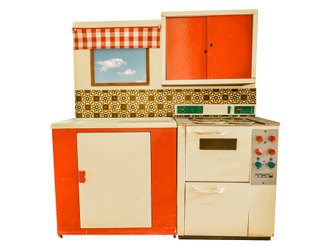 Vintage small seventies toy kitchen isolated on a white background