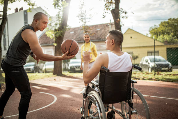 istock Disabled men playing basketball with friends 1278613939