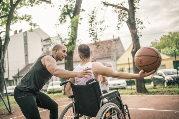 istock Disabled men playing basketball with friends 1278616608