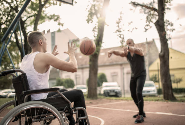 istock Disabled men playing basketball with friends 1278616695