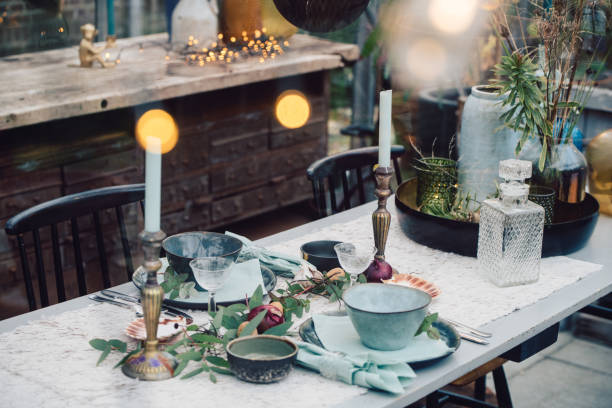 istock Decorated table in Christmas setting. Candle, plates and cutlery 1278617233